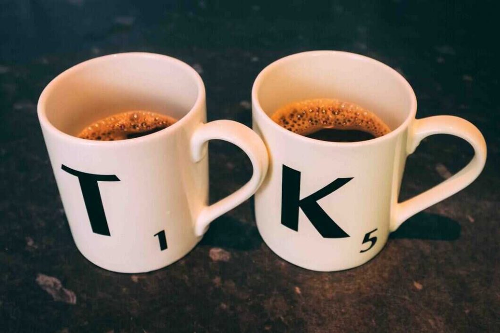 Scrabble cups with black coffee