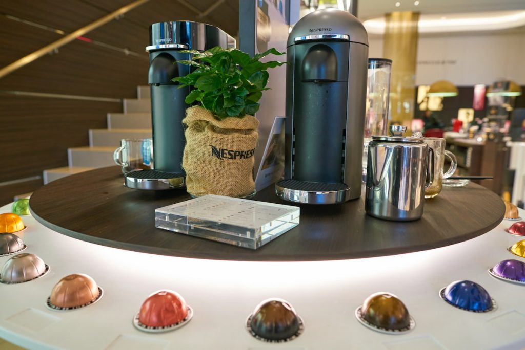 Nespresso Vertuo Machines with pods surronding it